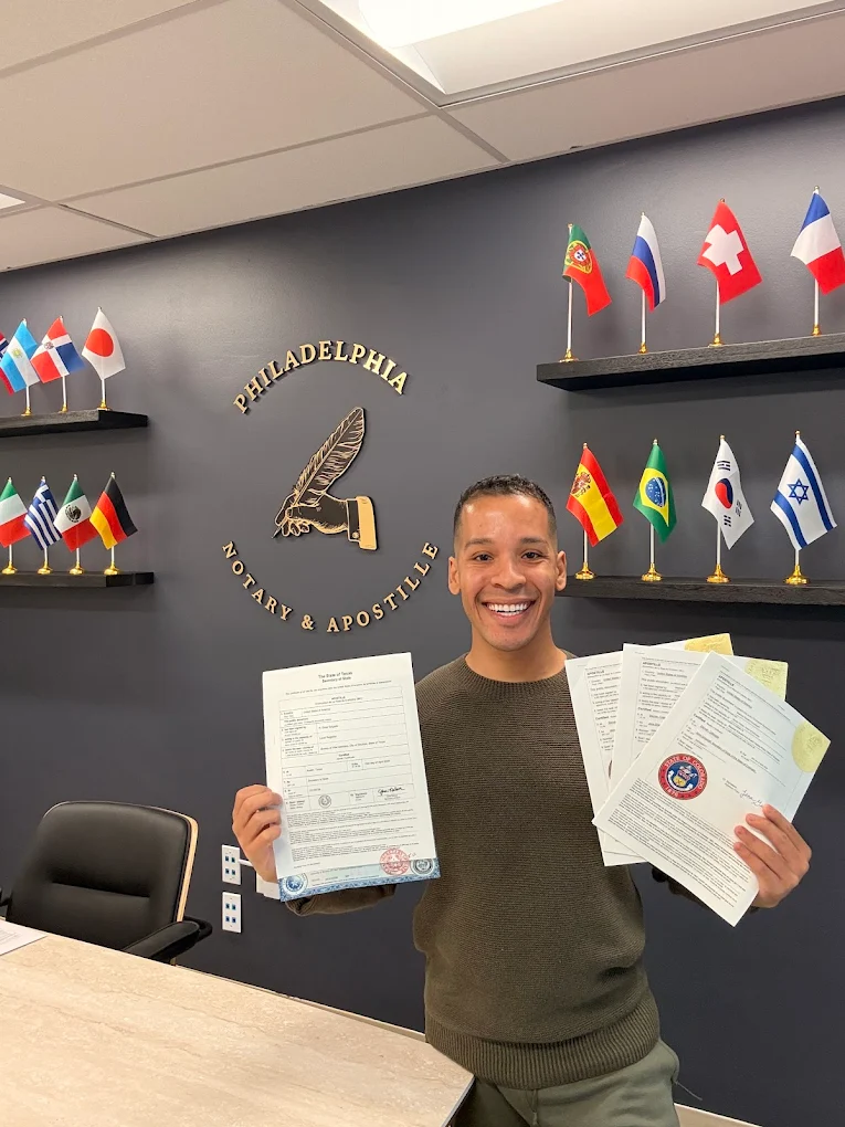 Brian Perez at Philadelphia Notary & Apostille holding apostilled documents